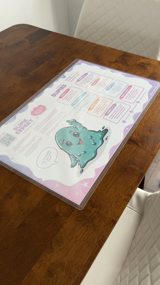 Reverse side of the slime play mat featuring Squidge, the Lil' Slimetastic slime mascot